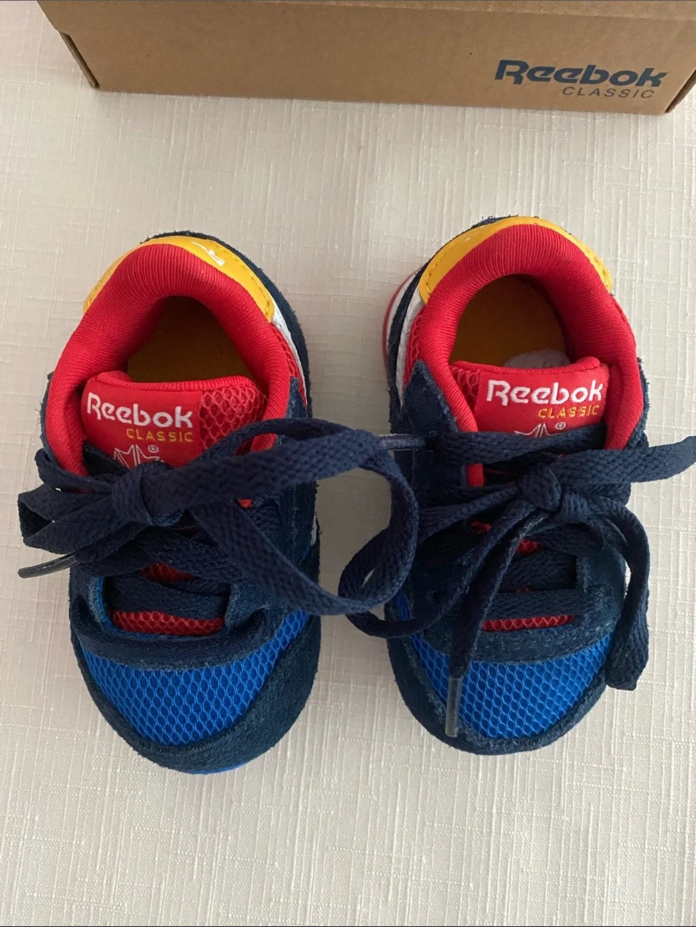 Reebok CL Leather Color Block Sneakers for babies.